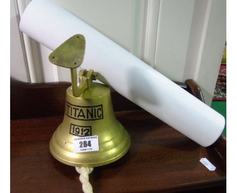 A Decorative 20th Century Reproduction Brass Bell inscribed Titanic 1912. Complete with hanging attachment and knotted rope r