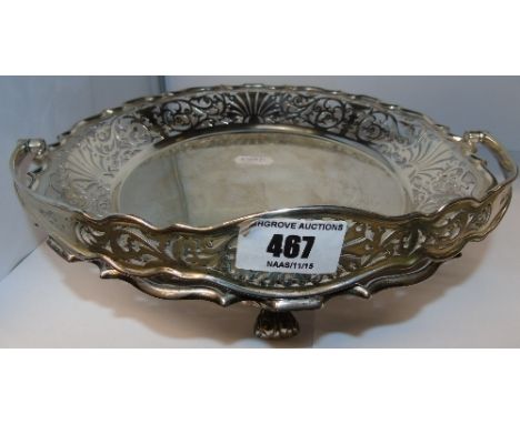 An Edwardian Silver Swing-Handled Basket with scalloped edge, hand-pierced work, sitting on three swept feet. Made by Walker 