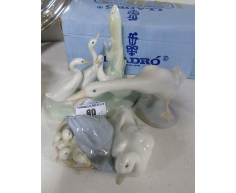 A Lladro Figural Group of Mother Duck & Ducklings (with box) along with a Bisque Lladro Swan & a Nao Cygnets Group (3).