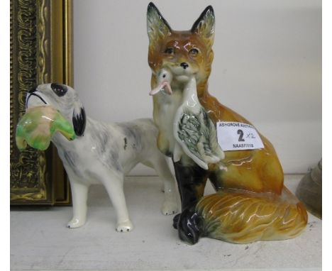 A Ceramic Figure of a Fox with Duck in Mouth, and another of a Setter & Game (2).