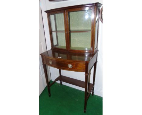 An Edwardian Bow Fronted Display Cabinet, the glazed top having a single glass shelf, above single drawer with inlaid design,