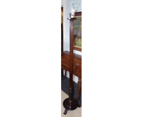 A Mahogany Standard Lamp; with turned column with twist detail standing on a quadrafoil base.