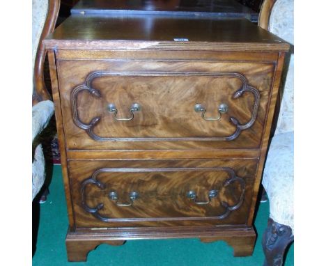 A 20th Century Commode, In the form of a small chest of drawers.