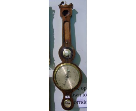 A 19th Century String Inlaid Mahogany Wheel Barometer; with silvered dial, lacking thermometer.