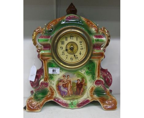 A Victorian Ceramic Mantel Clock, 14ins high.