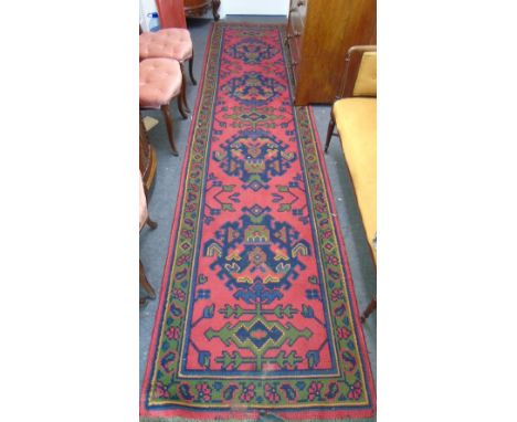 A 19th Century Knotted Red Ground Turkish Runner, c. 151" x 37".