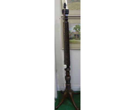 A Mahogany Standard Lamp; with turned column with twist detail standing on a quadrafoil base.