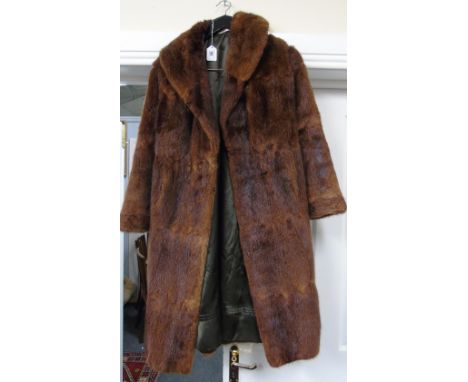A Ladies Vintage Dark Brown Fur Coat by Brahams of Reading.