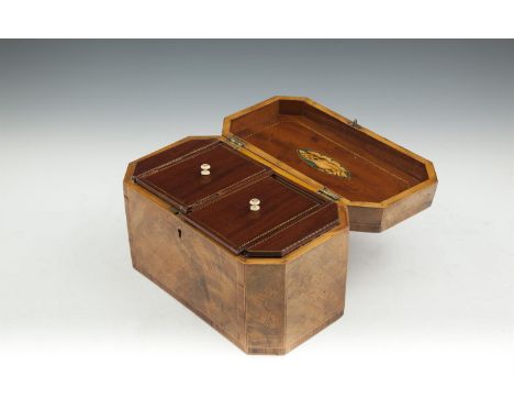A REGENCY INLAID MAHOGANY OCTAGONAL TEA CADDY, the hinged lid decorated inside and out with an oval holly and satinwood styli