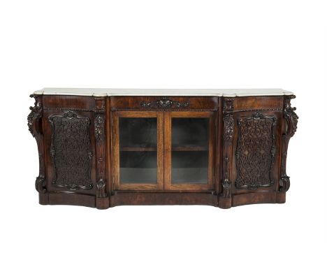 A VICTORIAN ROSEWOOD AND MARBLE TOPPED BREAKFRONT SIDE CABINET, mid 19th century, of shaped rectangular form, the fitted top 