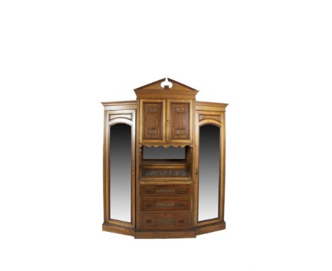 A  FINE VICTORIAN STAINED OAK BEDROOM SUITE, c.1890, comprising:- a breakfront wardrobe, with architectural pediment and cent