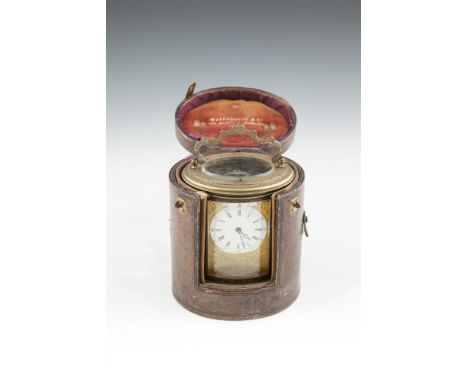 A VICTORIAN IRISH BRASS CARRIAGE CLOCK, of oval form by Waterhouse & Co., Dublin, in a travelling case