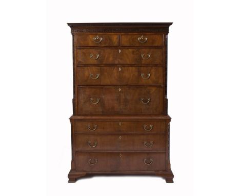A GEORGE III WALNUT SECRÉTAIRE CHEST-ON-CHEST, with pierced and blind fret decoration, above two short and two long cockbeade