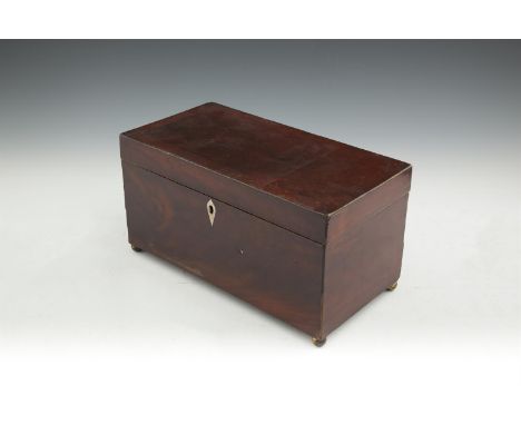 AN EARLY 19TH CENTURY INLAID MAHOGANY RECTANGULAR TEA CADDY, the crossbanded top enclosing a partially fitted interior, raise