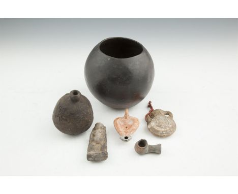 A COLLECTION OF EGYPTIAN AND ROMAN ANTIQUITIES, including an ancient steatite bottle of globular form, 12cm high; a Roman ter