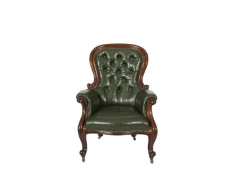 A VICTORIAN MAHOGANY FRAMED BALLOON BUTTON BACK GENTLEMAN'S ARMCHAIR, covered in green hide and raised on cabriole legs and s