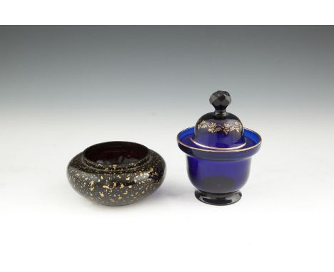 A REGENCY BLUE GLASS AND GILT DECORATED SUGAR BOX AND COVER, probably Dublin, c.1820, of circular form, surmounted with facet