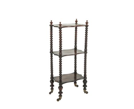 A VICTORIAN THREE-TIER ROSEWOOD WHATNOT, of compact size, with serpentine platforms joined by bobbin turned supports on balus