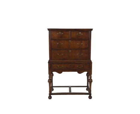 A GEORGIAN WALNUT AND BEECH CHEST ON STAND, basically 18th century, with moulded top above two short and three long drawers f