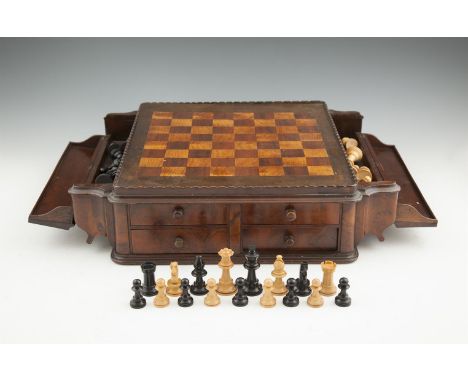 AN EDWARDIAN WALNUT MARQUETRY TABLE-TOP CHESS BOARD, the chequered top flanked by twin storage compartments, and containing a