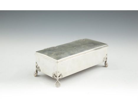 A SILVER RECTANGULAR CIGARETTE BOX, Dublin 1918, mark of Reid & Sons, Newcastle-on-Tyne, the hinged lid with strapwork decora