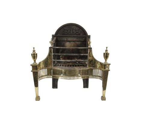 AN EARLY 19TH CENTURY IRON AND BRASS FIRE GRATE, of serpentine form, the domed top above pierced brass frieze with bar grill 