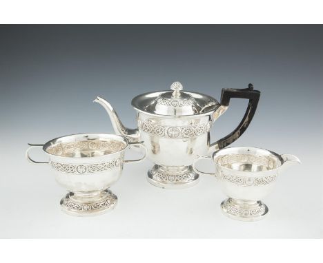 AN IRISH SILVER THREE-PIECE TEA SERVICE, Dublin 1908, makers mark of Edmond Johnson, comprising a teapot, two-handled sugar b