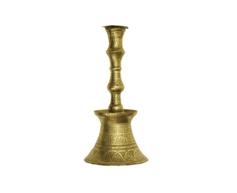 A TURKISH MAMALUQ REVIVAL BRASS CANDLESTICK, 18th Century, with flared rim, knopped stem and domed spreading base, engraved w