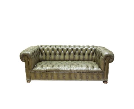 A CHESTERFIELD BUTTON BACK SOFA, covered in olive green hide. 203cm wide x 90cm deep x 74cm high