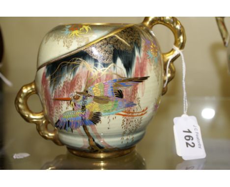 Carlton Ware early 20th century decorated in bright enamel colours with gilding depicting a bird in flight amongst Wisteria-t