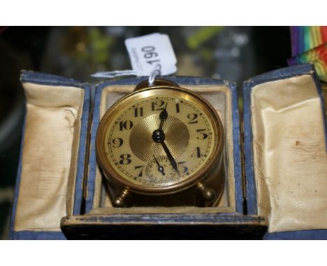 French brass travelling alarm clock in blue case circa 1930s