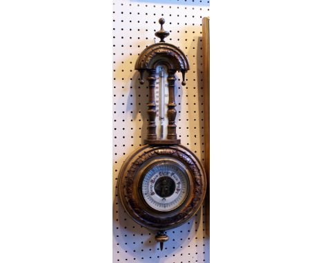 Victorian walnut barometer and thermometer in carved mahogany case 57 cm high