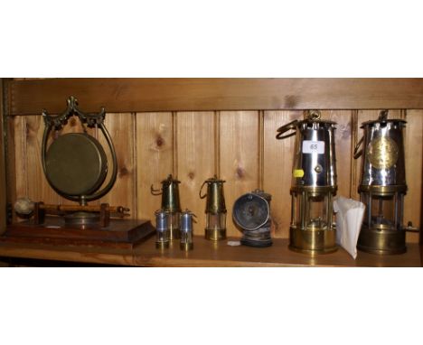 Two miner's lamps, four small ornamental lamps, a Premier Carbide lamp and a brass dinner gong