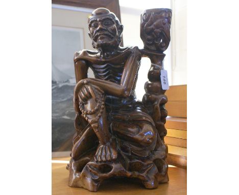 Oriental carved wood lamp base in the form of an old man holding his prayer beads - possibly Japanese