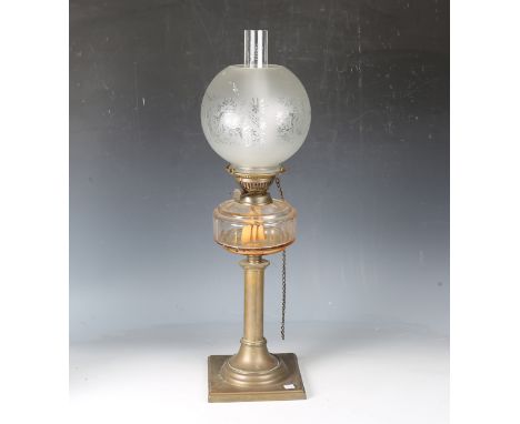 An early 20th century cut glass and brass table oil lamp with an etched glass shade, height 62cm.Buyer’s Premium 29.4% (inclu