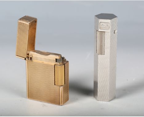 An S.T. Dupont Paris gilt metal pocket lighter, length 4.6cm, together with a hexagonal chromium plated lighter by Celine, Pa