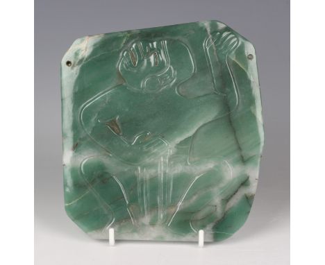 A pre-Columbian Olmec style carved apple green jade pectoral plaque, carved in low relief with a squatting chieftain, bearing