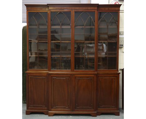 A late 19th century mahogany library bookcase cabinet, fitted with four lancet glazed doors above doors with applied border m