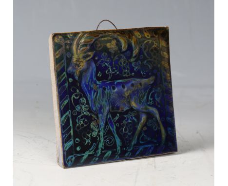 An early 20th century art pottery lustre tile, probably Pilkington's Royal Lancastrian, moulded slightly in relief with a sta