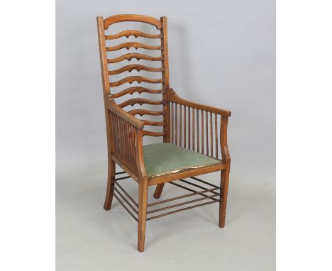 An Edwardian Arts and Crafts mahogany ladder back armchair, attributed to Wylie &amp; Lochhead, the armrests with satinwood c