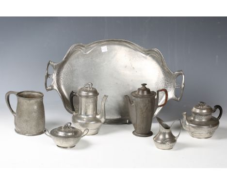 An Art Nouveau pewter tea set by Orivit, comprising teapot, hot water pot, sugar bowl and cover, cream jug and tray, together