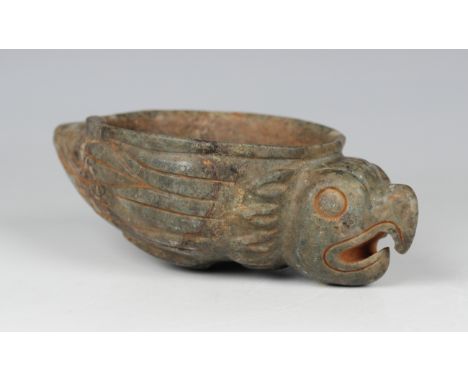 A pre-Columbian Mayan style carved green hardstone zoomorphic offering bowl, possibly 400-800 AD, finely modelled as a bird, 