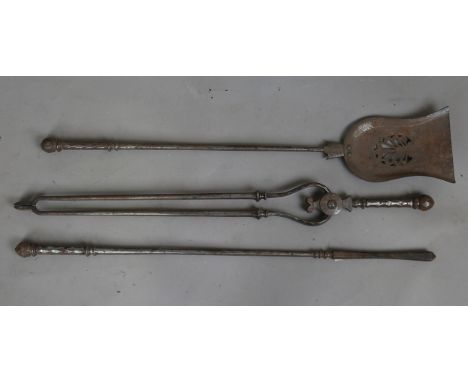 A set of three George III steel fire tools, each with a faceted cut handle, length 79cm. Note: from the contents of Runnymede