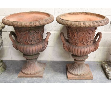A pair of 20th century terracotta garden urns, each of typical campana form with twin handles and relief cast acanthus scroll