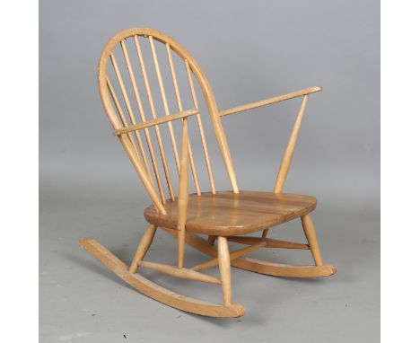 An Ercol beech and elm Windsor rocking armchair, height 83cm, width 68cm, together with an Ercol three-tier stand, width 91cm