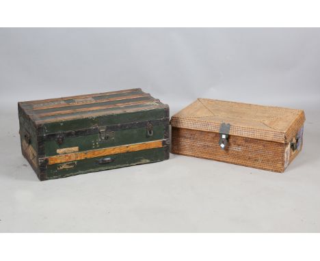 A 19th century canvas and wooden bound travelling trunk, width 72cm, together with an Indian rattan trunk, width 65cm.Buyer’s