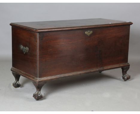 A George III mahogany trunk, the hinged lid above applied handles (one missing), raised on carved claw and ball feet, height 