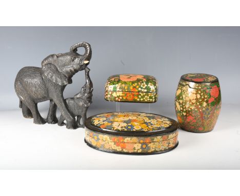 A 20th century Kashmiri oval box and cover, decorated with flowers, width 26cm, two further similar Kashmiri boxes and covers