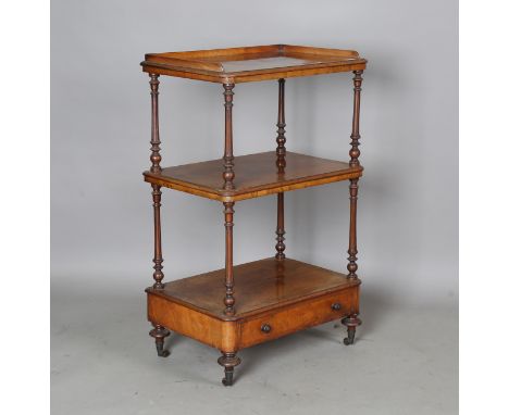 A Victorian burr walnut three-tier whatnot with galleried top, fluted supports and single drawer, on turned baluster legs and