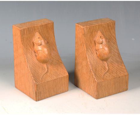 A pair of Robert 'Mouseman' Thompson oak bookends, each carved with typical mouse signature on an adzed surface, height 15cm.